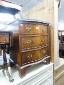 A SMALL FIGURED WALNUTWOOD SERPENTINE CHEST OF THREE LONG DRAWERS ON BRACKET FEET, 1'9" WIDE AND A