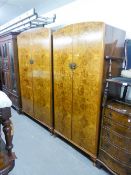 A FIGURED WALNUT WOOD BEDROOM SUITE OF THREE PIECES, VIZ A LADY'S AND GENT'S FITTED WARDROBE WITH
