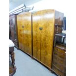 A FIGURED WALNUT WOOD BEDROOM SUITE OF THREE PIECES, VIZ A LADY'S AND GENT'S FITTED WARDROBE WITH