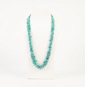 'BRANCH' TURQUOISE BEAD NECKLACE, THE SILVER OVAL CLASP, 23" LONG AND A 9ct GOLD RING, THE 'V'