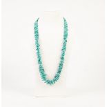 'BRANCH' TURQUOISE BEAD NECKLACE, THE SILVER OVAL CLASP, 23" LONG AND A 9ct GOLD RING, THE 'V'