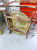 A BRASS TOPPED CIRCULAR COFFEE TABLE ON FOLDING FRAME