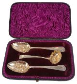 A cased set of two George III silver gilt berry spoons and sifter spoon, hallmarked London 1799/1807