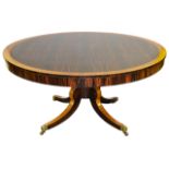 A Regency coromandel and satinwood circular centre table,