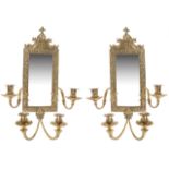 A pair of gilt brass four branch mirror back wall sconces, 20th century