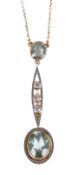 A delicate Edwardian aquamarine and diamond pendant necklace,