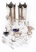 A collection of silver plated cruets, cruet spoons and white metal vases