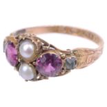 An early Victorian pearl and garnet set ring