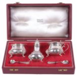 A cased three piece silver cruet suite for Harrods London, hallmarked London 1961