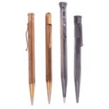 A small collection of 9ct gold and silver retracting pencils