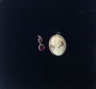 An antique flat cut garnet drop and a gold mounted cameo brooch