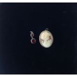 An antique flat cut garnet drop and a gold mounted cameo brooch