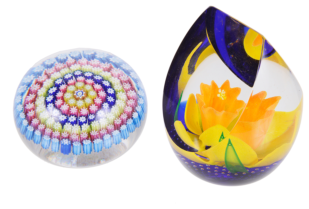 A Caithness glass paper weight and another millefiori caned paper weight,