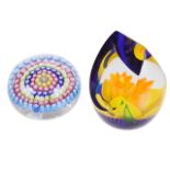 A Caithness glass paper weight and another millefiori caned paper weight,