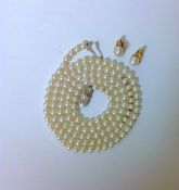 A cultured pearl single row opera length necklace