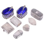 A selection of silver cruets, boxes, vestas and boxes