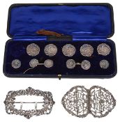 A boxed set of eleven Edwardian silver buttons, hallmarked Birmingham 1903, each chased with a court