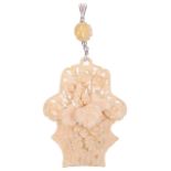 A Victorian/Edwardian carved ivory floral basket pendant