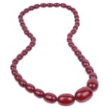 A graduated cherry red amber bead necklace