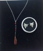 A delicate Art Deco carnelian pendant on chain and a pair of amusing 'fox' earrings