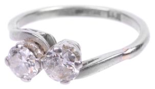 A two stone diamond set crossover platinum mounted ring