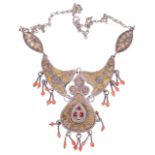 An attractive Eastern mixed metal and coral bead articulated necklace,