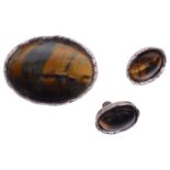 A modernist silver mounted tigers eye brooch and matching earrings