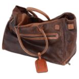 An Adpel brown leather travel bag