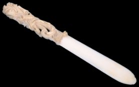 A late 19th century finely carved ivory paper knife