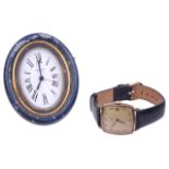 An Omega gentleman wristwatch and a Cartier travel clock