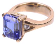 A contemporary large rectangular cut tanzanite and diamond ring