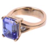 A contemporary large rectangular cut tanzanite and diamond ring