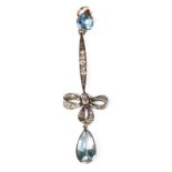 A delicate Edwardian aquamarine and diamond ribbon drop pendant