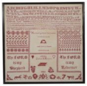 A Victorian needlework sampler by Julia A Moore, dated 1883