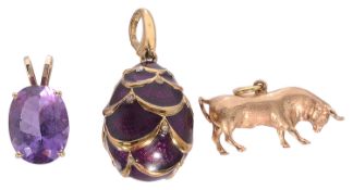 A Continental 14K gold amethyst pendant and two other pendants