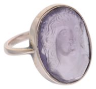 An unusual carved amethyst cameo set ring