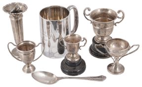 A collection of Northwood Golfing silver trophy cups, a silver tankard, silver vase and spoon