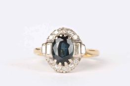 An 18ct gold, blue green sapphire and diamond cluster ring