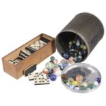 A set of bone and ebony dominoes and a collection of Victorian and later glass marbles