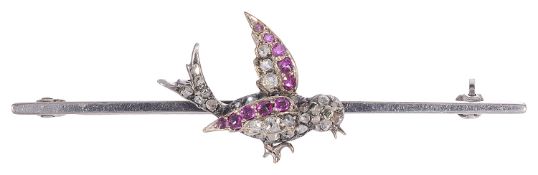 An unusual Edwardian ruby and diamond bird bar brooch