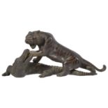 A late 19th century Japanese bronze of a tiger attacking a crocodile probably by Genryusai Seiya