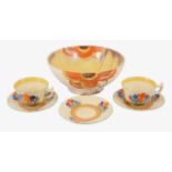 A Clarice Cliff Bizarre "Rodante" pattern bowl and a part set of Bizarre "Crocus" pattern teacups wi