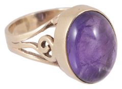 A large 9ct gold mounted cabochon amethyst dress ring