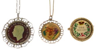 An Elizabeth II gold sovereign pendant on chain and two other coin pendants