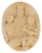 A Victorian carved ivory roundel family portrait