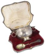 A cased Edwardian twin handled christening bowl and spoon, hallmarked London 1909