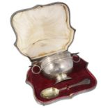 A cased Edwardian twin handled christening bowl and spoon, hallmarked London 1909