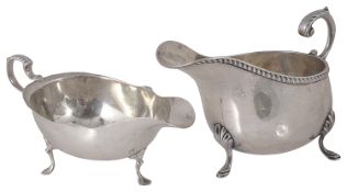 Two Edwardian silver sauce boats, hallmarked London 1908 and Birmingham 1909