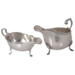 Two Edwardian silver sauce boats, hallmarked London 1908 and Birmingham 1909