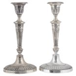 A pair of Edwardian Adam style silver candlesticks, hallmarked London 1907/1908